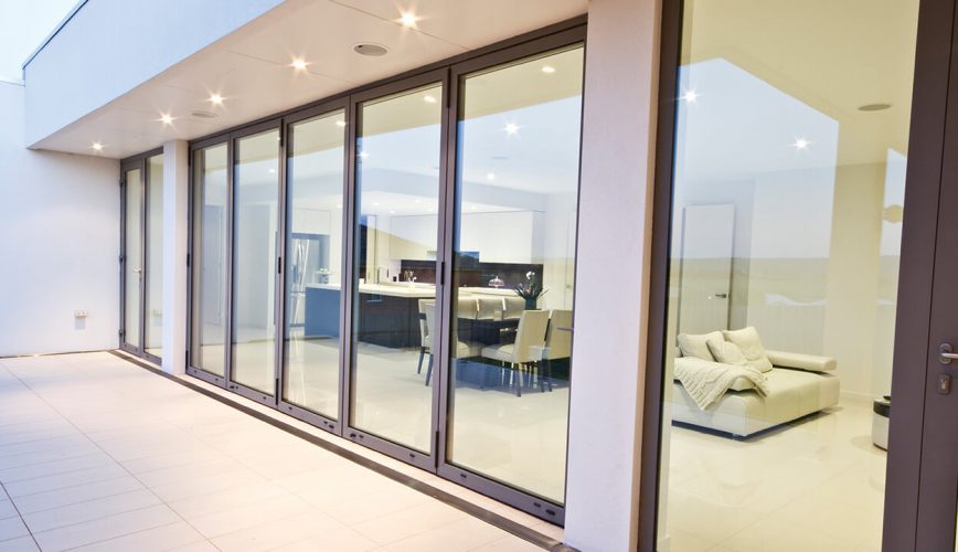 A closed grey aluminium bifold door