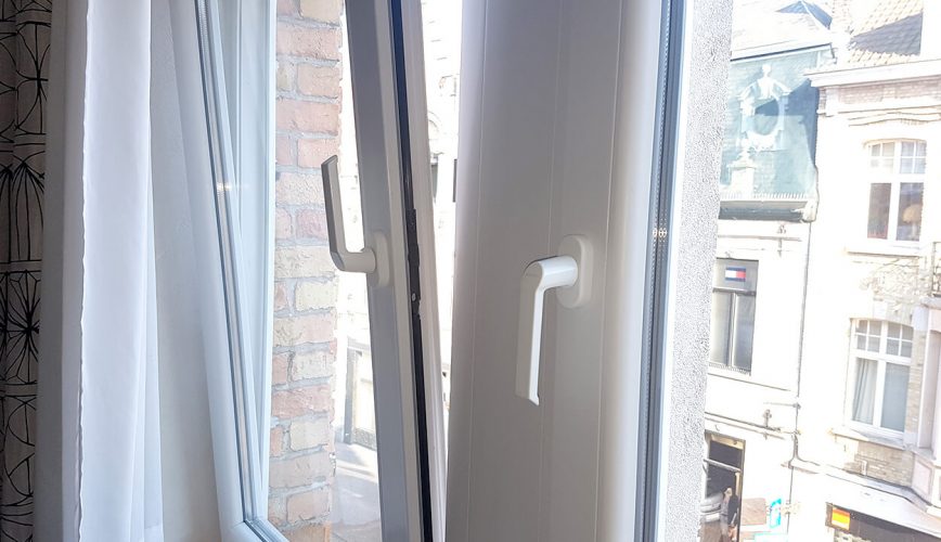 Interior view close up of a white tilt and turn window