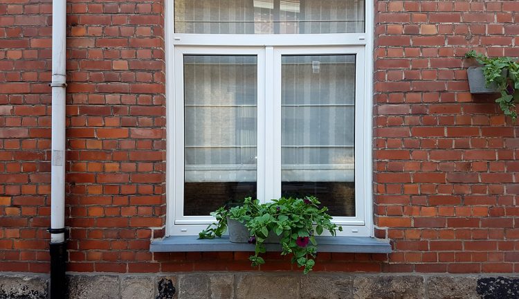 White uPVC tilt and turn window installation