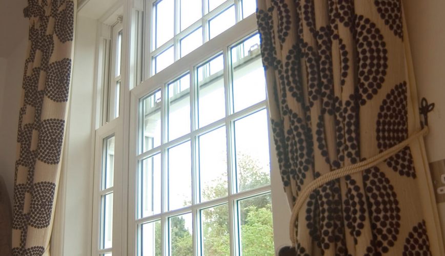 White uPVC vertical slider window close up