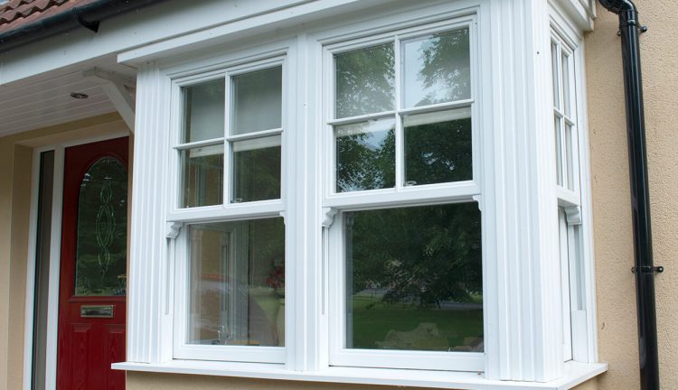 White uPVC vertical sliding bay windows
