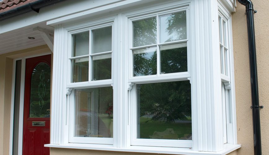 White uPVC vertical sliding bay windows