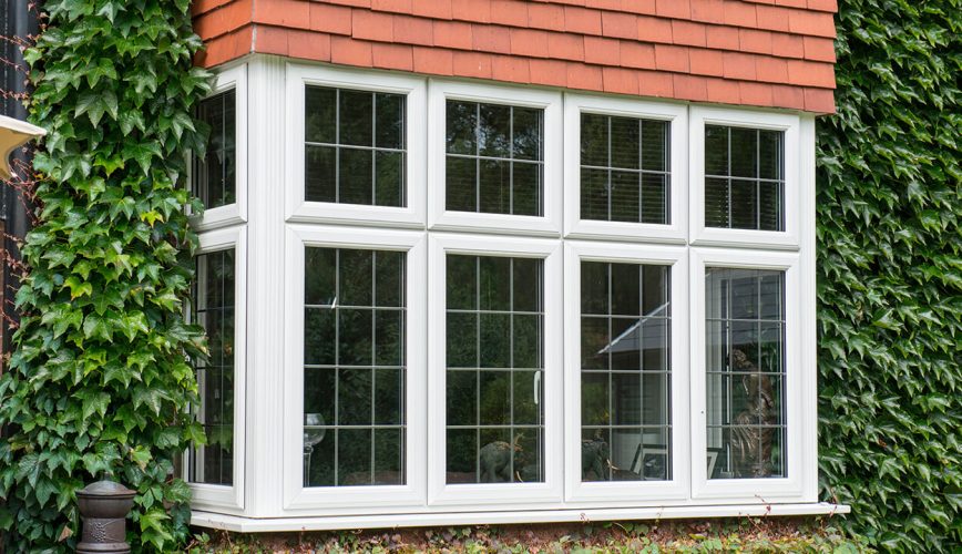 White uPVC bay windows with leaded glass