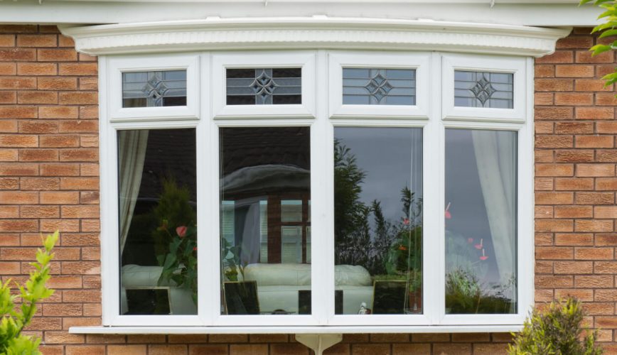 White uPVC bow window with stained glass