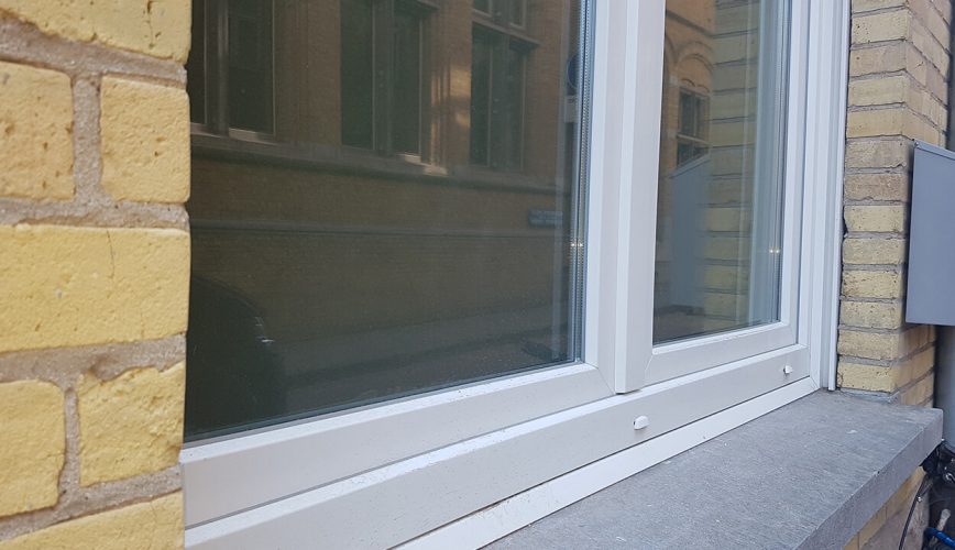 White uPVC tilt and turn window close up