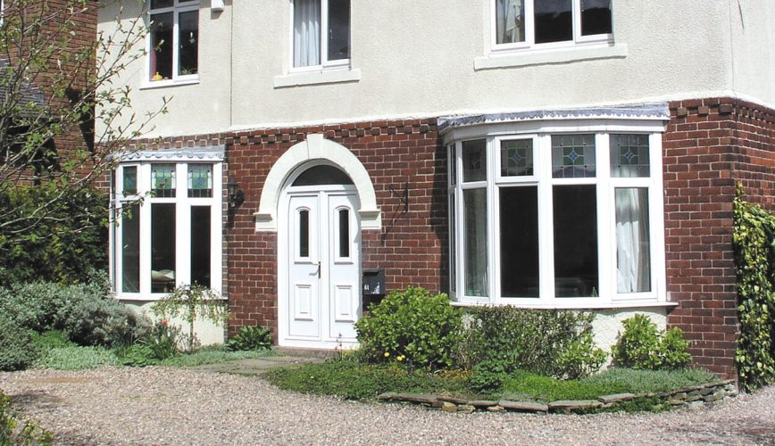 Installation of white uPVC bow windows